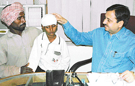 Dr Manoj K. Sobti with Gurmukh Singh, who was operated upon to restore his eyesight, in Ludhiana on Saturday. 