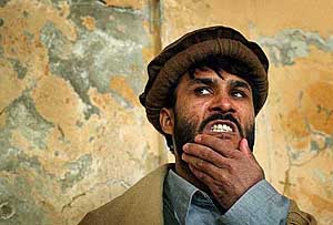 Afghan Reza Khan reacts as the court delivers its verdict