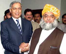 Pakistani Prime Minister Shaukat Aziz (L) with Fazal-ur- Rehman, Leader of the Opposition in Pakistans Lower House of parliament, after their meeting in Islamabad on Saturday.