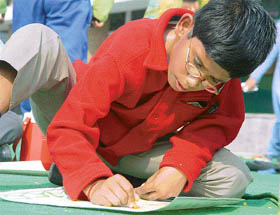 A student paints in library-related competitions at St Johns School in Chandigarh