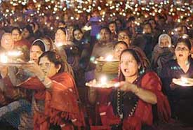 Devotees perform aarti during the celebration of Hanuman Jayanti at Nehru Park, Sector 32, Chandigarh