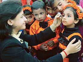 A teacher applies make-up on a student of The Gurukul, Tribune Mitra Vihar, Madanpura, near Ramgarh, during their annual day celebration