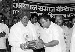 A file photo showing Mr Parmanand Goel presenting a gold brick to Haryana Chief Minister Om Prakash Chautala 