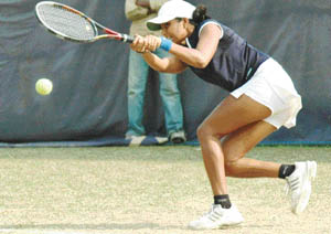 Krushmi Chheda of Mumbai returns a shot during the final match against Harsimran of Panjab University in Chandigarh on Monday.