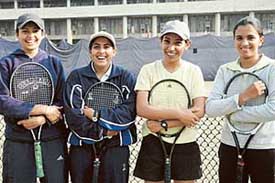 Members of both winner and runner-up teams, Mumbai University and Panjab University, all smiles at the conclusion of the All-India Inter-university Tennis Championship. 