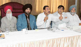 Members of the Punjab Bakery Association at a press conference in Ludhiana on Monday
