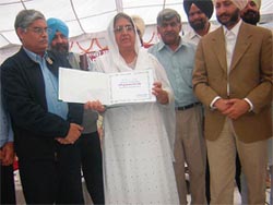Punjab Deputy Chief Minister Rajinder Kaur Bhattal releases a book at the inaugural function of Punjabi Saptah in Patiala on Monday. 