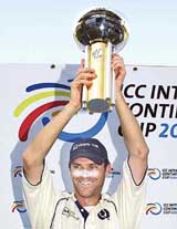 Scotlands cricket captain Craig Wright holds the cup after victory over Canada in the ICC Inter-Continental Cup tournament in Sharjah