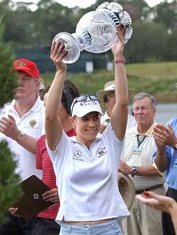 Annika Sorenstam of Sweden raises the ADT Championship trophy