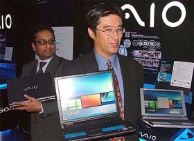 Kunimasa Suzuki, Senior General Manager, e-marketing and Solutions Division, Sony Corporation, right, and Mohit Parasher, General Manager, AV/IT Division Sony India Pvt. Ltd, pose with a Sony Vaio laptop during its launch in New Delhi