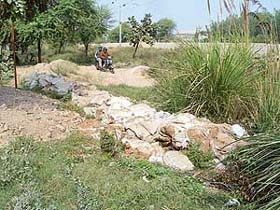 A view of a nullah between Sector 19 and Industrial Area in Panchkula that has been encroached upon by colonisers and is being used as a short cut by residents of the area