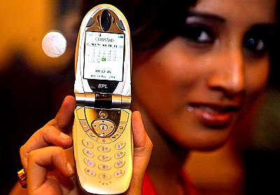 A model poses with mobile phone at a launch in Kolkata on Wednesday