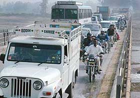 Long queues of vehicles caught in a traffic jam on the Ghaggar bridge at Bhankharpur village following the recarpeting of the Zirakpur-Lalru stretch of the Kalka-Ambala highway
