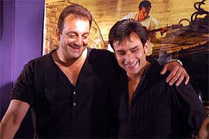 Bollywood actors Sanjay Dutt and Saif Ali Khan pose for photographers in Kolkata on Tuesday