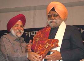 Mr Buta Singh, Governor of Bihar, being honoured by Dr S.P. Singh, Vice-Chancellor of Guru Nanak Dev University, in Amritsar on Wednesday.