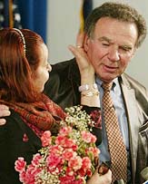 After 60 years, Holocaust survivor Andre Nowacki (right) from Long Beach, New York, reunites with Hanna Morawiecka, from Warsaw, Poland, after she arrives at JFK Airport in New York on Wednesday. 