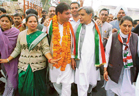 The local MP, Mr Pawan Kumar Bansal, and the Mayor, Ms Kamlesh, campaign for Mr Harmohinder Singh Lucky (garlanded) in Sector 20, Chandigarh, on Friday.