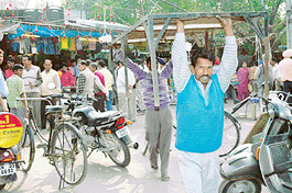 Enforcement staff of the Municipal Corporation remove encroachments 