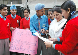 Students of Lawerance Public School, Mohali, educate the residents about solid waste disposal in Phase VI, Mohali, on Saturday.