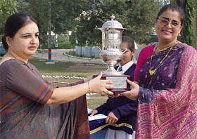 AFWWA President Anuradha Malhotra gives the best school in IAF trophy to the Air Force School, Ambala, Principal, Ms Jatinder Kaur