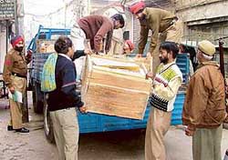 Cops confiscate crackers from the Ramditti Ekta Dharamshala in Ludhiana on Saturday. I.V.