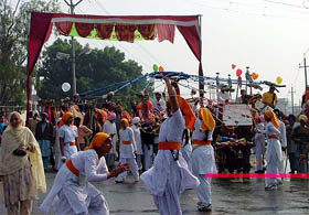 Girls play ‘gatka’ during a cultural procession to mark the beginning of the two-day heritage festival in Bathinda