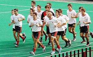Members of the Spanish hockey team jog during a practice session at the Sector 42 hockey stadium in Chandigarh 