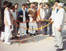 BJP leaders lay garlands on the potholed roads in Sector 10, Panchkula, on Sunday.