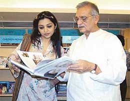 Actress June Malia with eminent writer, director and lyricist Gulzar during an interactive session with book lovers at a book store in Kolkata on Sunday. 