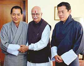Bhutan King Jigme Singe Wangchuk shakes hands with BJP President L.K. Advani as Bhutan Crown Prince Jigme Khesar Namgyal Wangchuck looks on in New Delhi on Sunday  