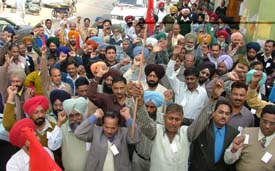 Members of the BSNL Employees Union protest at a rally organised in Ludhiana on Monday