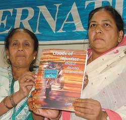Ms Champa Devi Shukla, and Ms Rasheeda Bee, winner of Goldmen Environmental Prize, release the Amnesty International report Clouds of injustice  Bhopal disaster 20 years on at Constitution Club in New Delhi on Monday. 