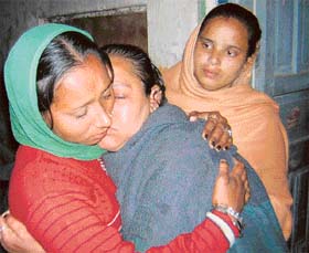 Karamjit’s mother being consoled by relatives in Patiala