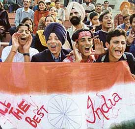 Youngsters cheer Indian team during 2nd hockey test match between India and Spain at the Sector 42 Stadium in Chandigarh