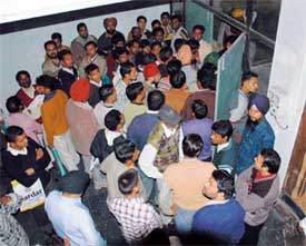 A large number of candidates wait to appear for an interview for the post of beldar at PAU in Ludhiana on Tuesday