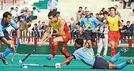 William Xalxo dives to check Spanish forward during the second hockey Test between India and Spain at Sector 42 Hockey Stadium in Chandigarh 