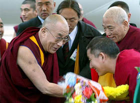 The Dalai Lama is welcomed on his arrival in Elista, Russia, on Monday