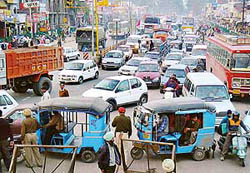 Policemen divert traffic to Rajpura at Zirakpur following a depression in the bridge over the Ghaggar on the Chandigarh-Ambala road at Bhankharpur village near Dera Bassi on Wednesday. 