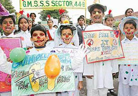 Students of Government Model Senior Secondary School, Sector 44, take part in an AIDS awareness rally in Chandigarh on Wednesday. 
