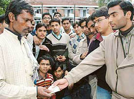 Students donate money to the father of a cancer patient at Panjab University, Hostel No 3 in Chandigarh on Wednesday.