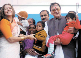 Union Minister of Youth Affairs and Sports Sunil Dutt, Union Minister of Health & Family Welfare A Ramdoss and socialite Nafisa Ali with AIDS-afflicted children during the AIDS Awareness Run, held by the CII in the Capital on Wednesday.