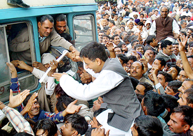 The Indian Youth Congress president, Mr Randeep Singh Surjewala, is helped on to the bus by his supporters after he and other Congress activists courted arrest at the Matka Chowk in Chandigarh 