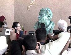 Ms Sonia Gandhi looks at the bust of Rajiv Gandhi at a science centre in Mauritius on Wednesday. 