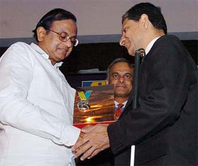 Union Finance Minister P. Chidambaram presents the Helen Keller Award to visually handicapped J. Mehta, an employee of an MNC, on the eve of World Disabled Day in New Delhi