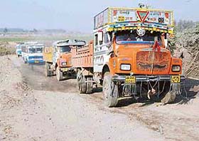 Ambala-bound traffic moves at a snails pace on a temporary link road connecting Ramgarh in Panchkula with Mubarikpur in Dera Bassi on the Ghaggar river bed in Mubarikpur village
