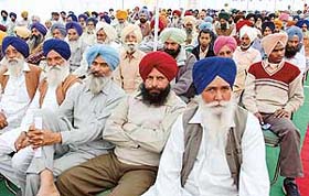 Members of milk producers’ cooperative societies attend a function at Milkfed plant, Mohali