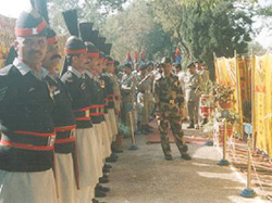 Pakistani Rangers stand guard outside the venue of the meeting between their officers and the BSF at Suchetgarh in the Pakistan territory on Tuesday. 
