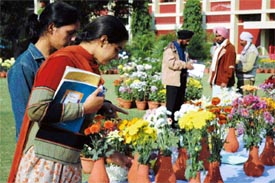 Students appreciate a display at a flower show on the PAU campus in Ludhiana 