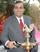 Reliance group Chairman Mukesh Ambani lights a lamp to inaugurate the Second Upper Crust Food Show 2004 at the World Trade Center in Mumbai on Friday. 