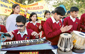 Visually challenged students of the VRTC present a song during a rally for the disabled taken out in Ludhiana